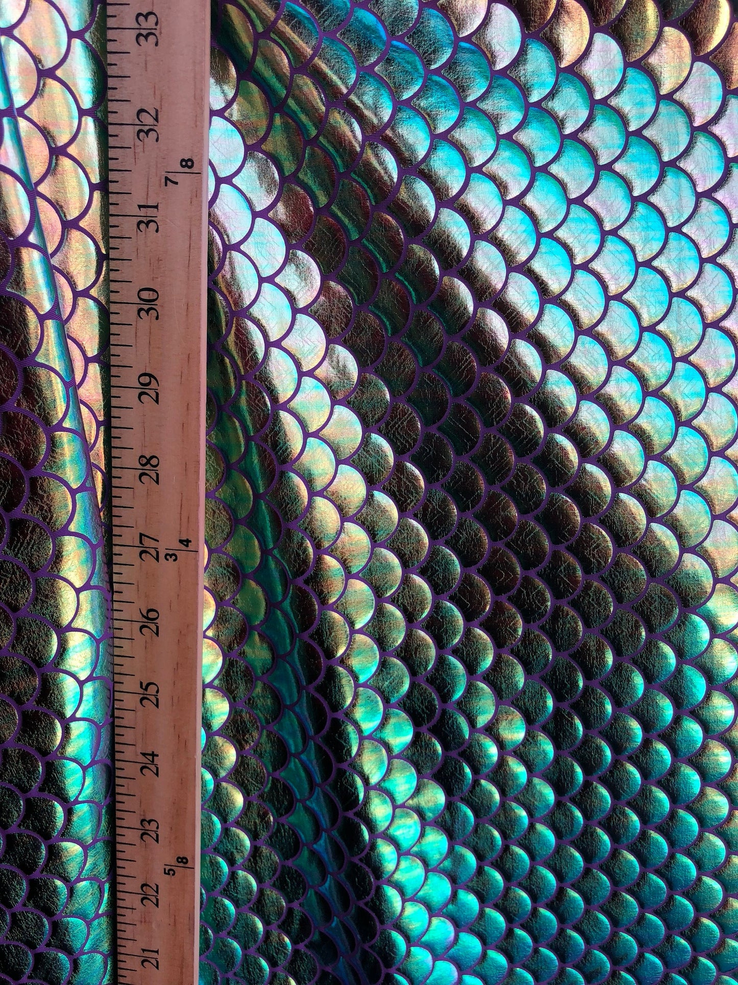 New mermaid design iridescent purple green fish scales foil 4way Stretch 58/60" Sold by the YD. Ships Worldwide from Los Angeles California.