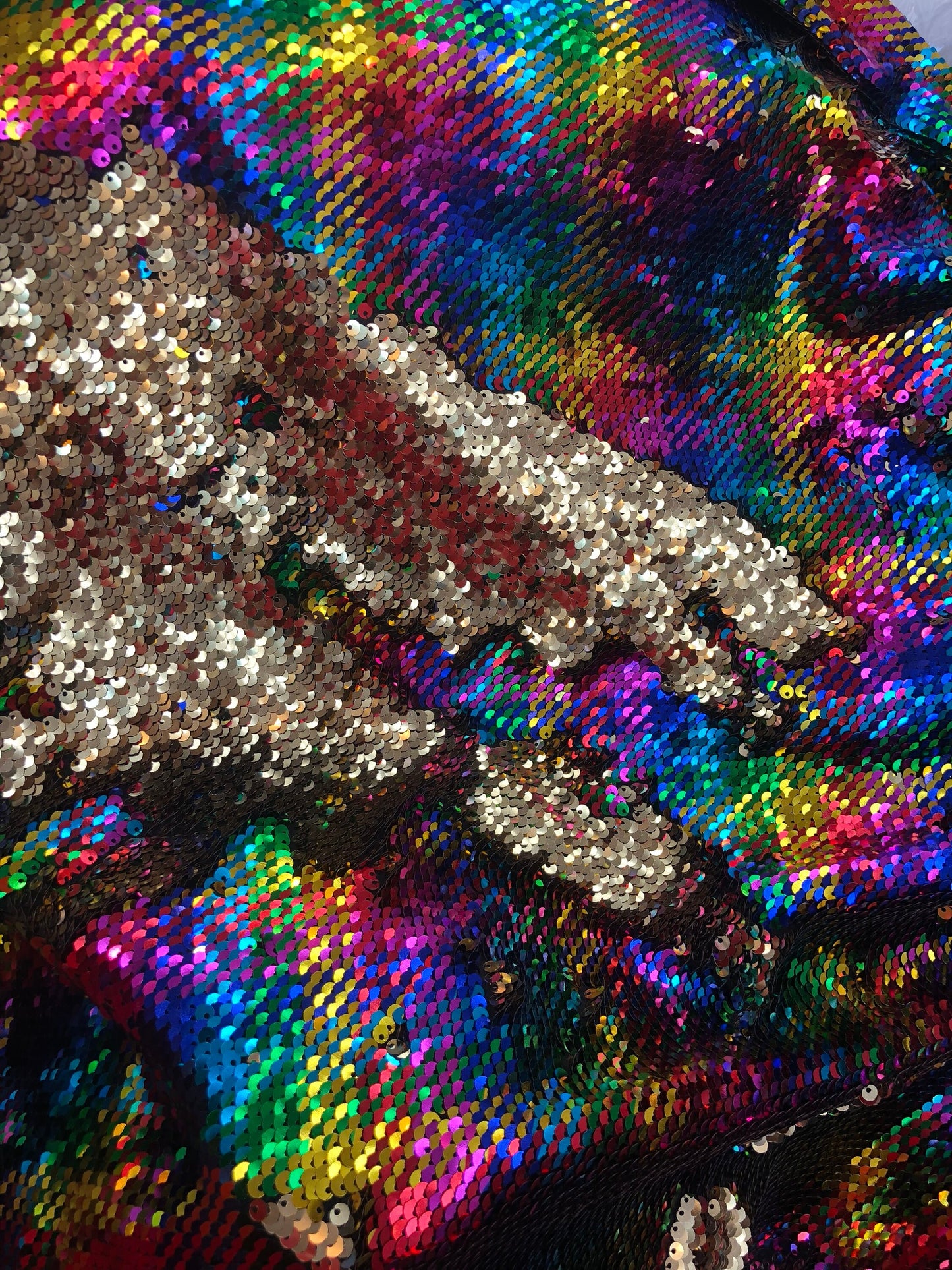 New hologram rainbow/gold reversible sequins on spandex base 2way Stretch 58/60" Sold by the YD. Ships worldwide from Los Angeles CA USA.