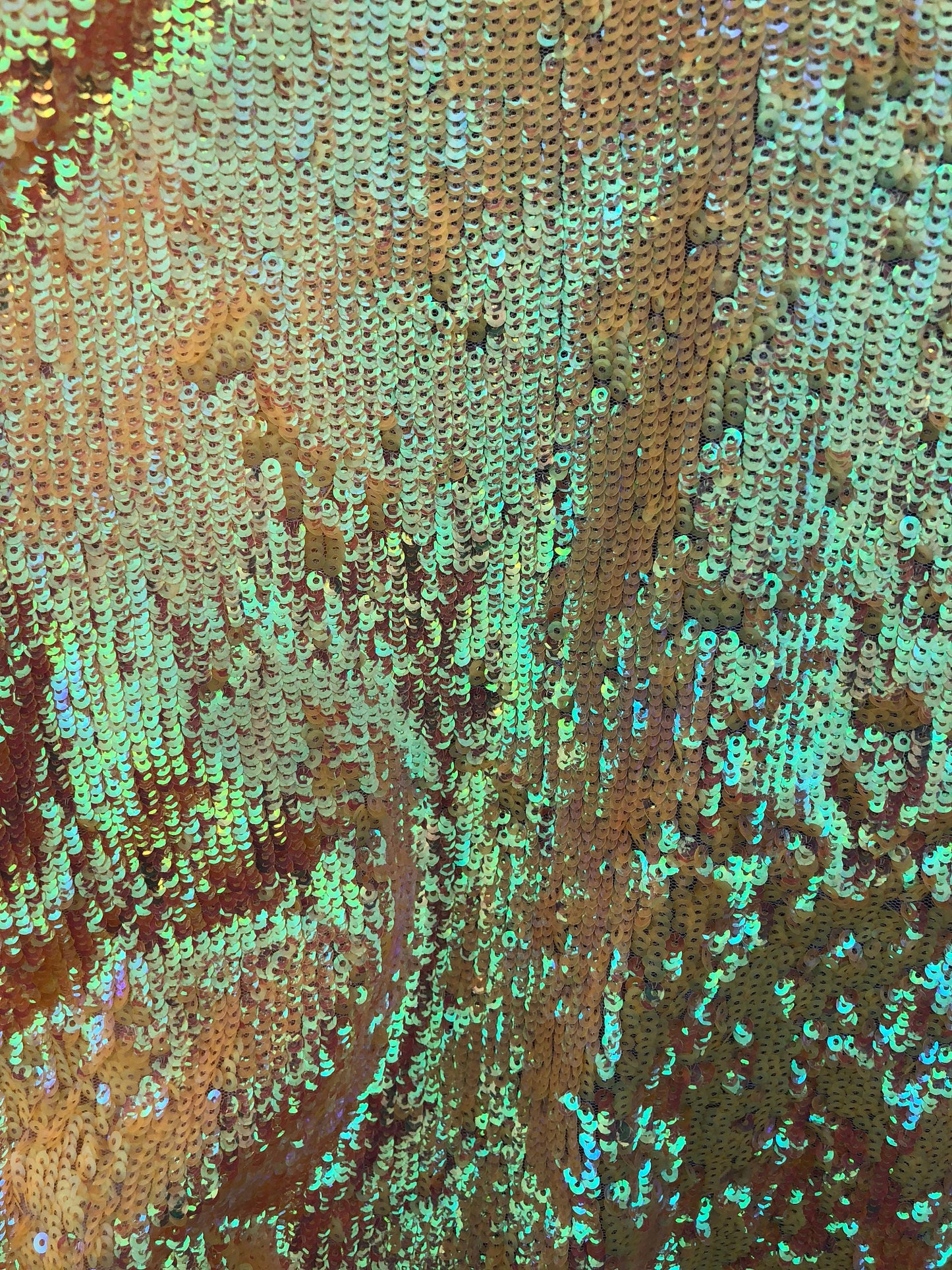 New sequins iridescent orange coral on stretch mesh 2way 58/60" Sold by the YD. Ships worldwide from Los Angeles California USA.