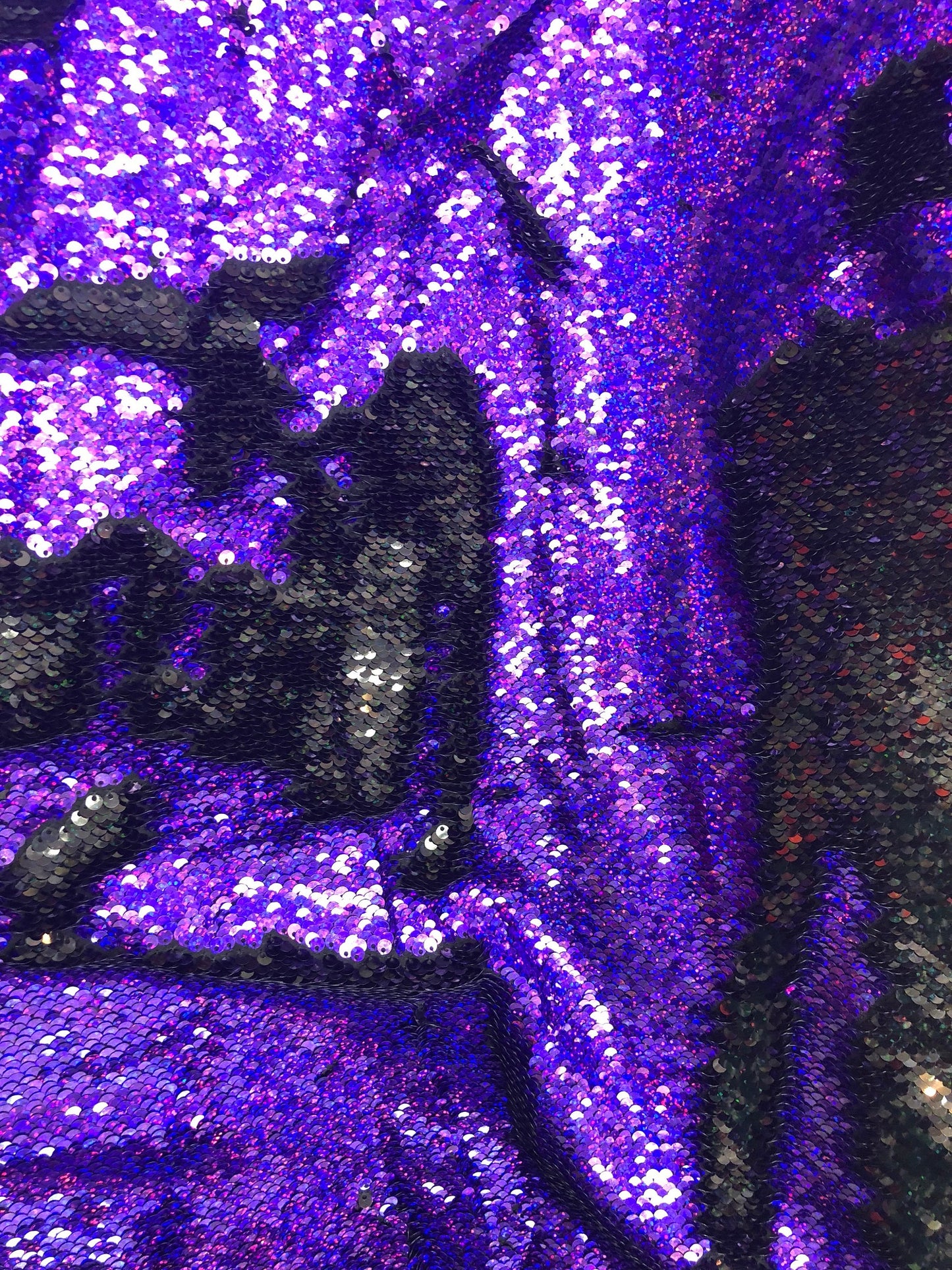 New flip up hologram sequins black/purple reversible sequins in spandex base 2way 58/60" Sold by the YD. Ships worldwide from L.A CA