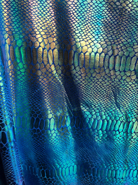 New iridescent metallic nylon spandex dragon design 4way stretch 58/60" Sold by the YD. Ships worldwide from Los Angeles California USA.