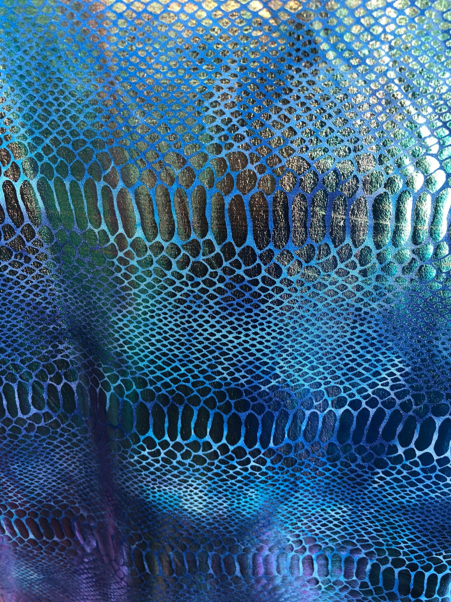 New iridescent metallic nylon spandex dragon design 4way stretch 58/60" Sold by the YD. Ships worldwide from Los Angeles California USA.