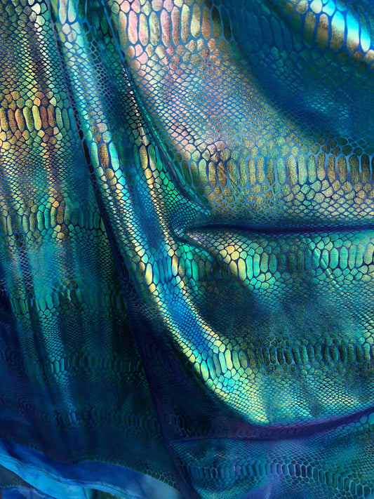 New tie dye iridescent foil crocodile design blue/green 4 way stretch 58/60" Sold by the YD. Ships worldwide from Los Ángeles California USA