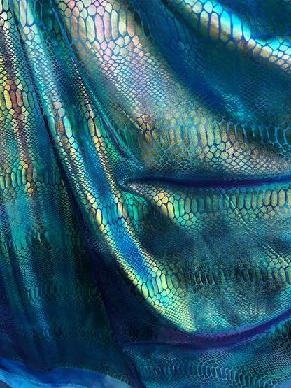 New tie dye iridescent foil crocodile design blue/green 4 way stretch 58/60" Sold by the YD. Ships worldwide from Los Ángeles California USA