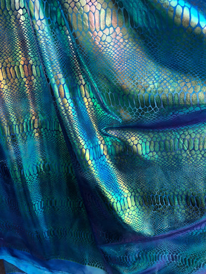 New tie dye iridescent foil crocodile design blue/green 4 way stretch 58/60" Sold by the YD. Ships worldwide from Los Ángeles California USA