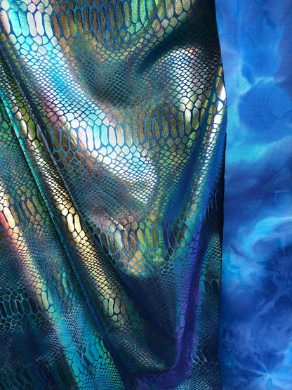 New tie dye iridescent foil crocodile design blue/green 4 way stretch 58/60" Sold by the YD. Ships worldwide from Los Ángeles California USA