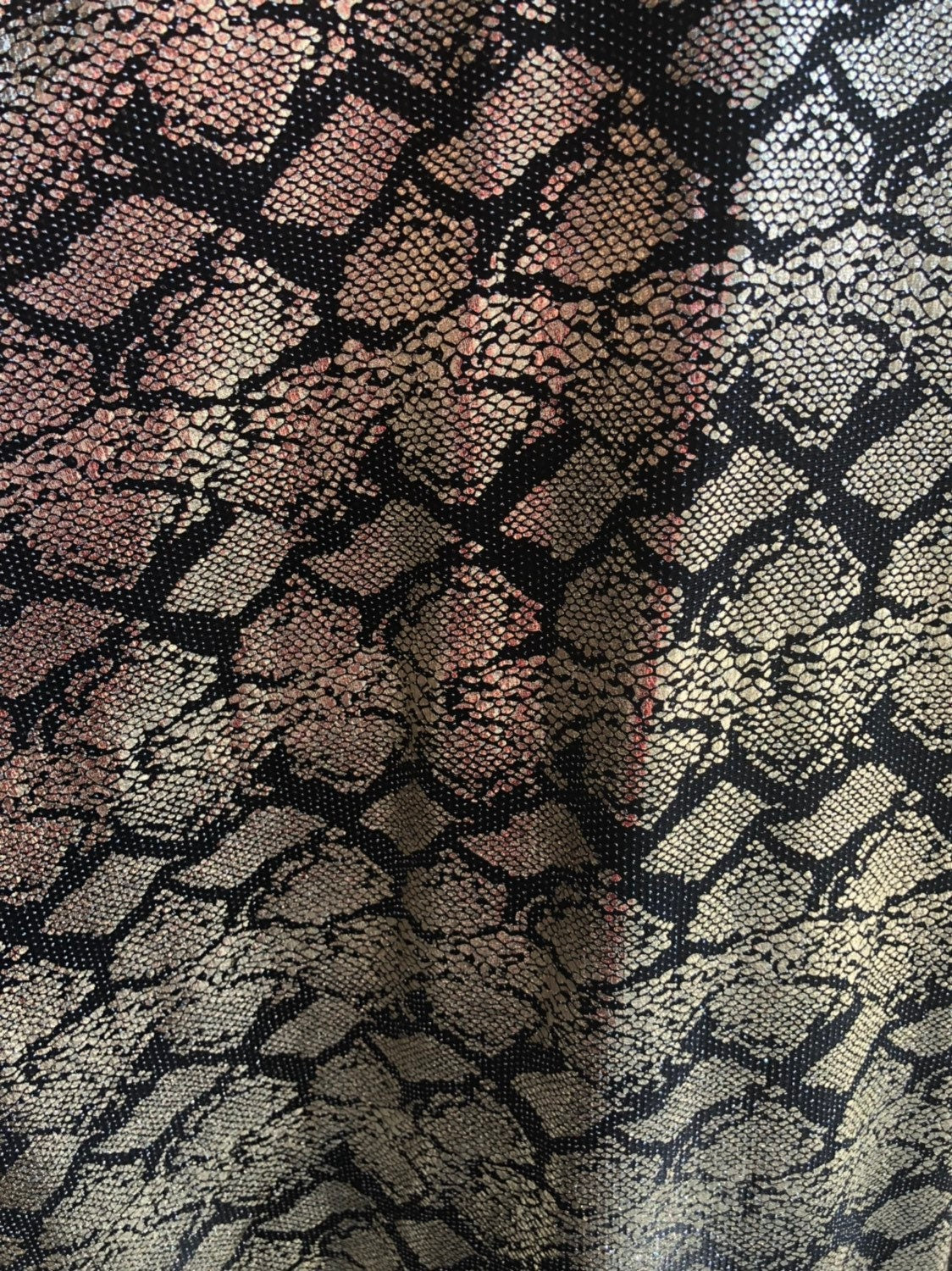 New iridescent snake design foil on slinky spandex 4way stretch 58/60" Sold by the YD. Ships worldwide from Los Angeles California USA.