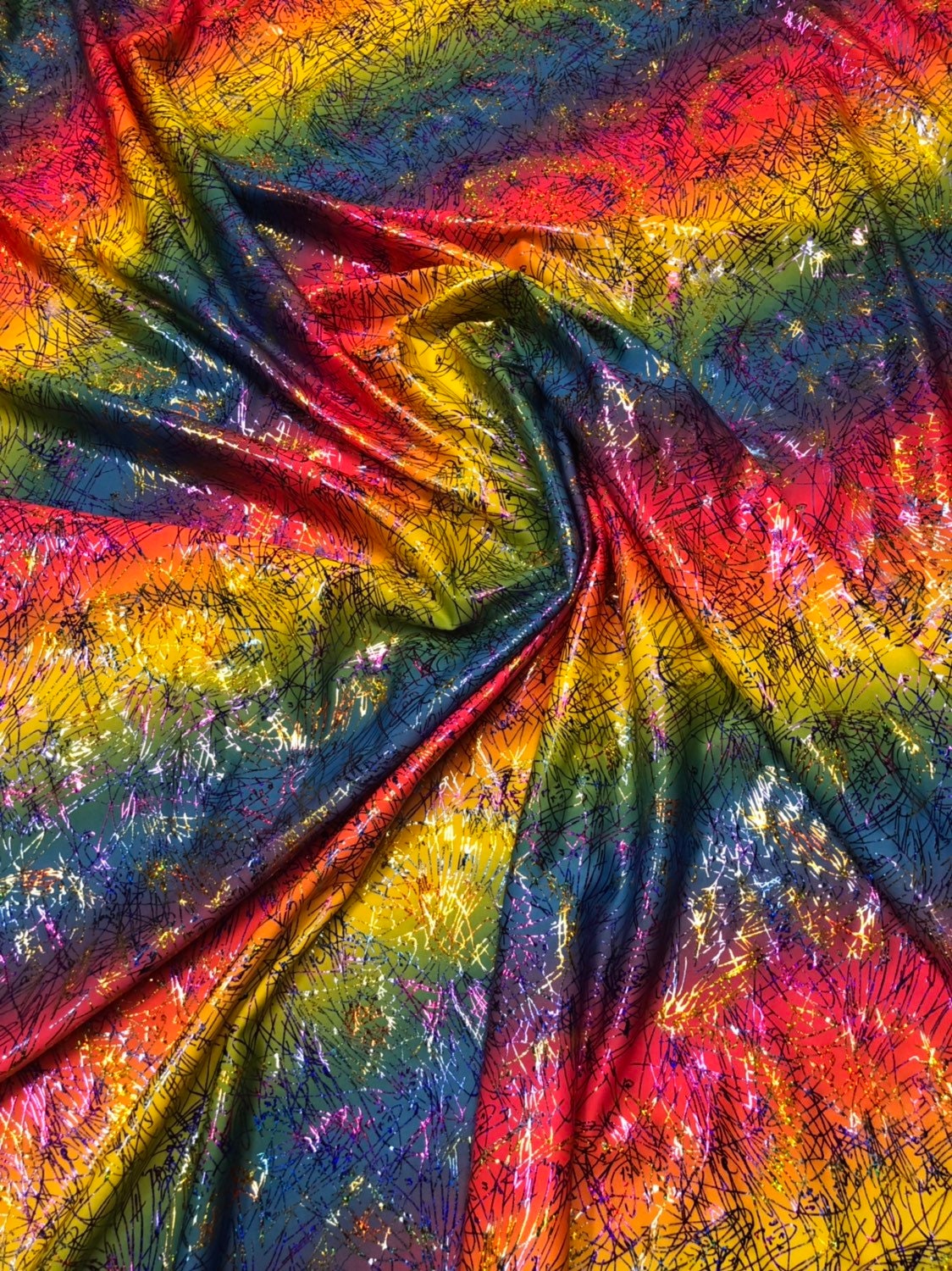 Bang bang design multicolor hologram foil print in nylon spandex 4way stretch 58/60" Sold by the YD. Ships worldwide from Los Angeles CA USA