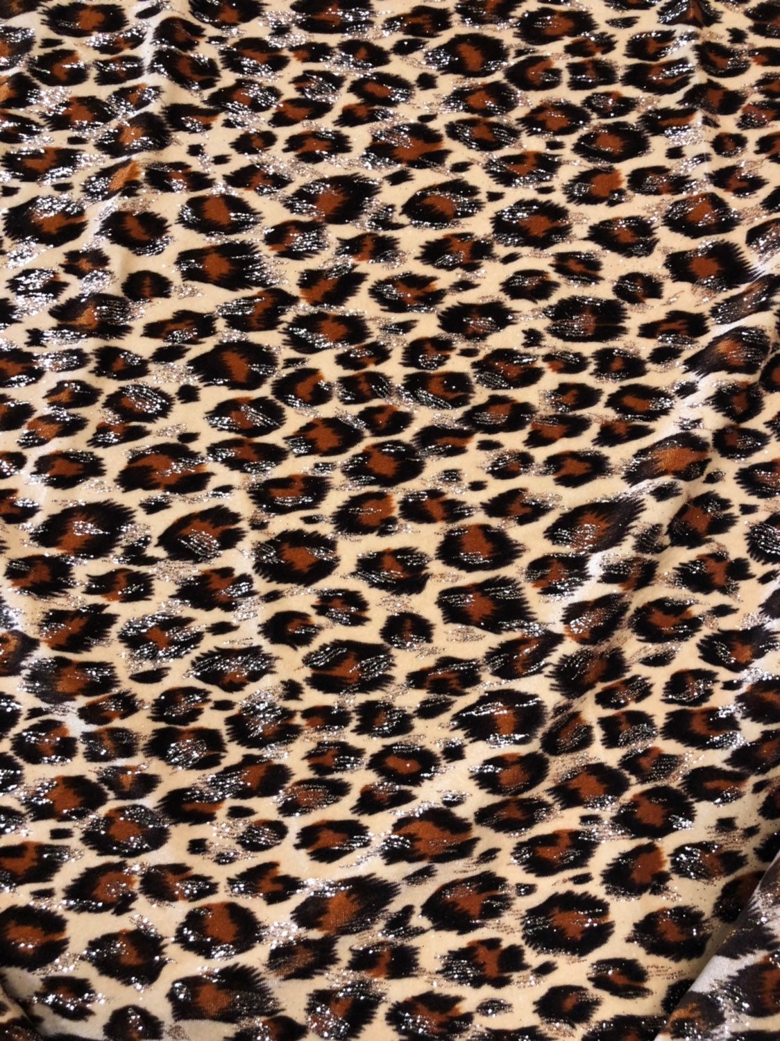 Leopard design with gold glitter print on velvet 420gsm 4way stretch 58/60" Sold by the YD. Ships worldwide from Los Angeles California USA.