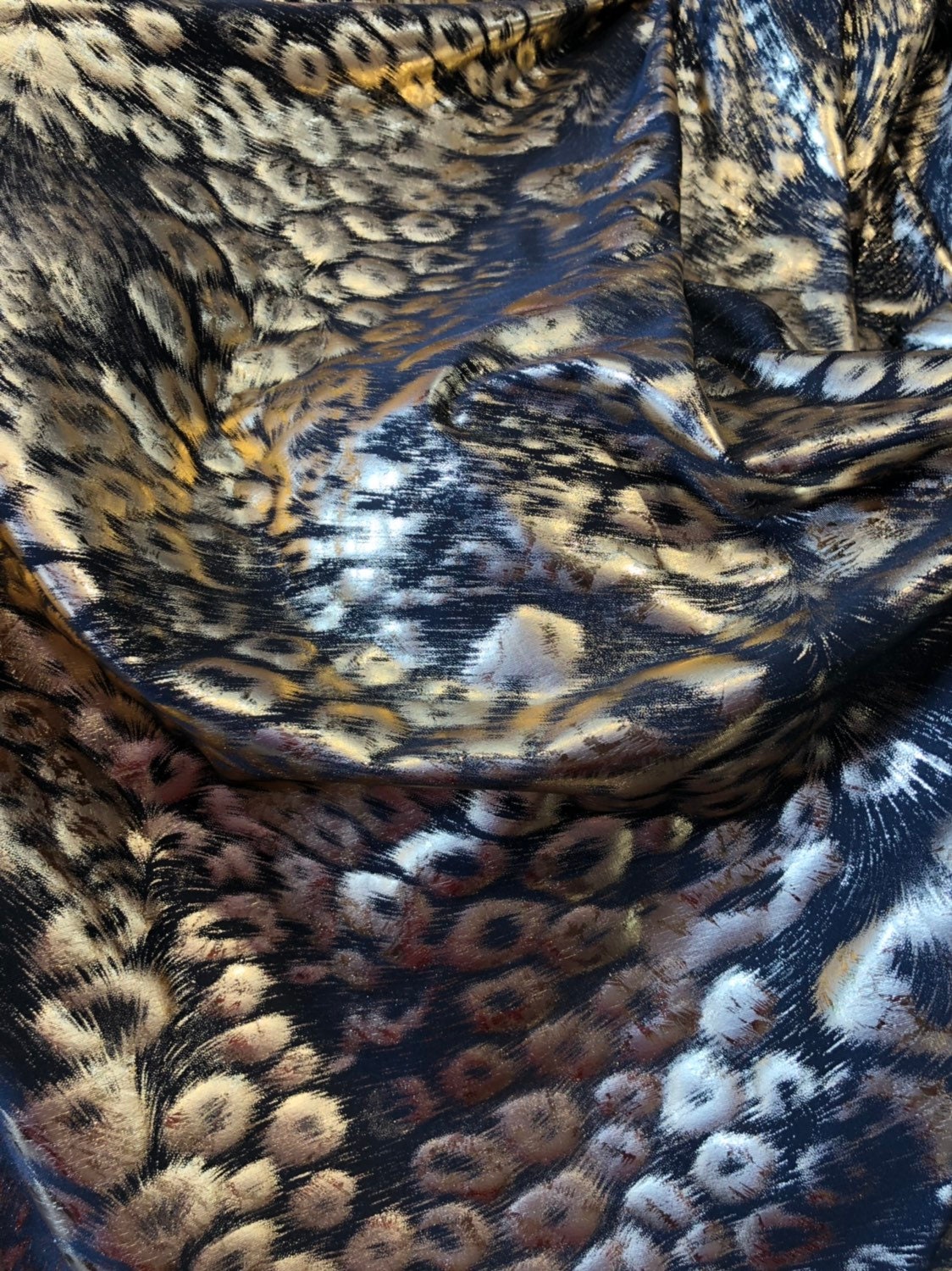 Animal print design black/gold metallic spandex 4way stretch 58/60" Sold by the YD. Ships worldwide from Los Angeles California USA.