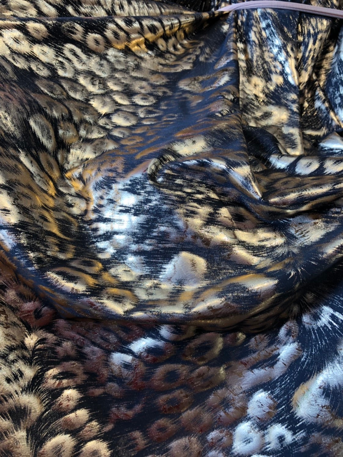 Animal print design black/gold metallic spandex 4way stretch 58/60" Sold by the YD. Ships worldwide from Los Angeles California USA.
