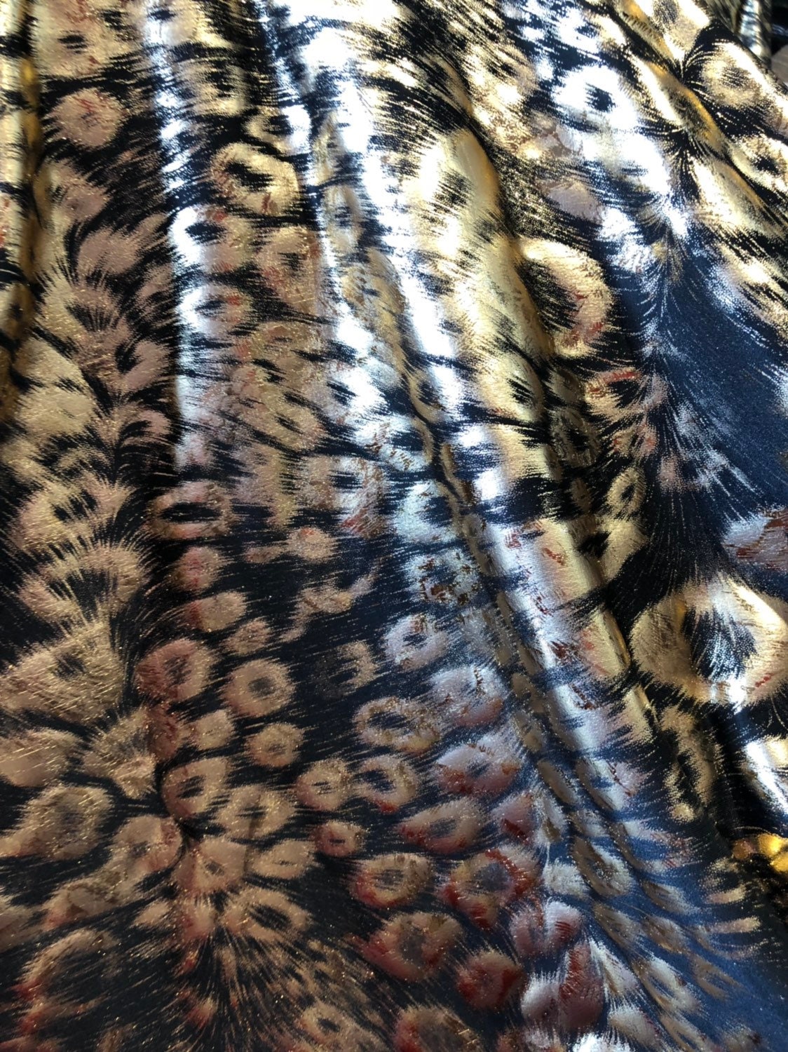 Animal print design black/gold metallic spandex 4way stretch 58/60" Sold by the YD. Ships worldwide from Los Angeles California USA.