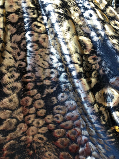 Animal print design black/gold metallic spandex 4way stretch 58/60" Sold by the YD. Ships worldwide from Los Angeles California USA.