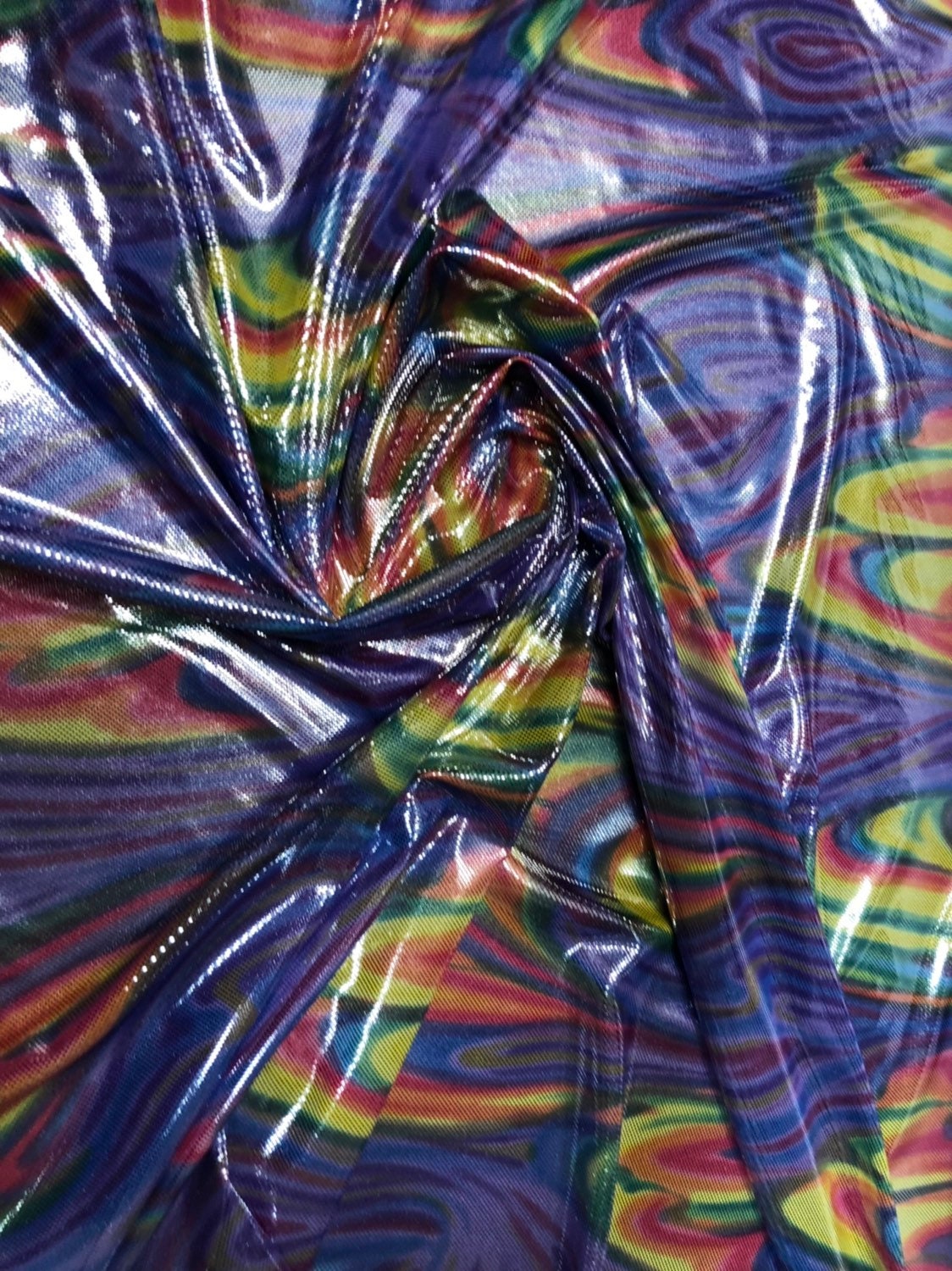 Paisley rainbow design metallic nylon spandex with foil dots 4way stretch 58/60" Sold by the YD. Ships worldwide from Los Angeles California