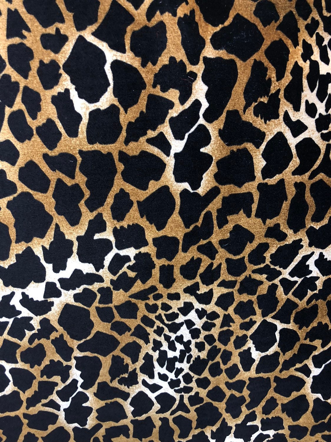 Giraffe design print on good quality stretch velvet 4way 58/60" Sold by the YD. Ships worldwide from Los Angeles California USA.