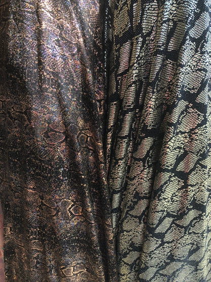 New iridescent snake design foil on slinky spandex 4way stretch 58/60" Sold by the YD. Ships worldwide from Los Angeles California USA.