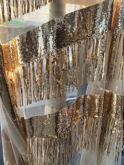 Chainette fringe sequins on mesh base 2 way stretch 55/57" Sold by the YD. Ships worldwide from Los Angeles California USA.