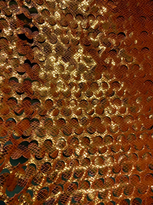 Lacer cut orange/gold stretch velvet with foil 4way stretch 58/60" Sold by the YD. Ships worldwide from Los Angeles California USA.