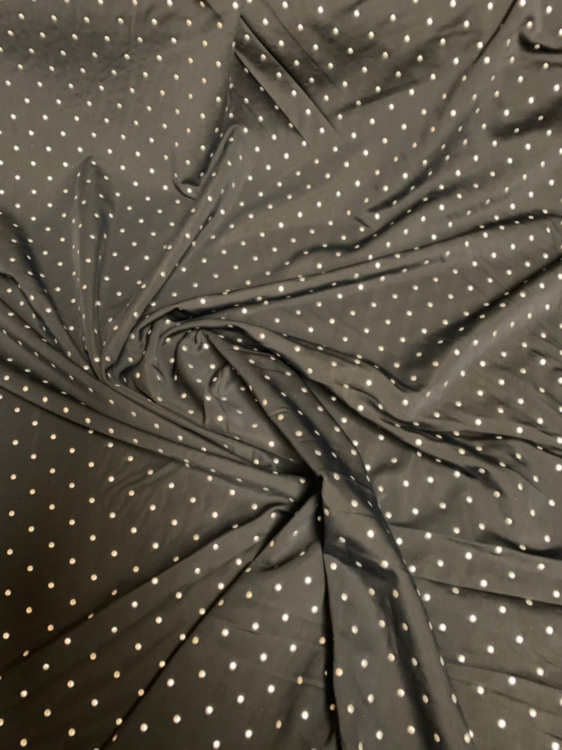 Metallic dots on heavy nylon spandex 4way stretch 58/60" Sold by the YD. Ships worldwide from Los Angeles California USA.