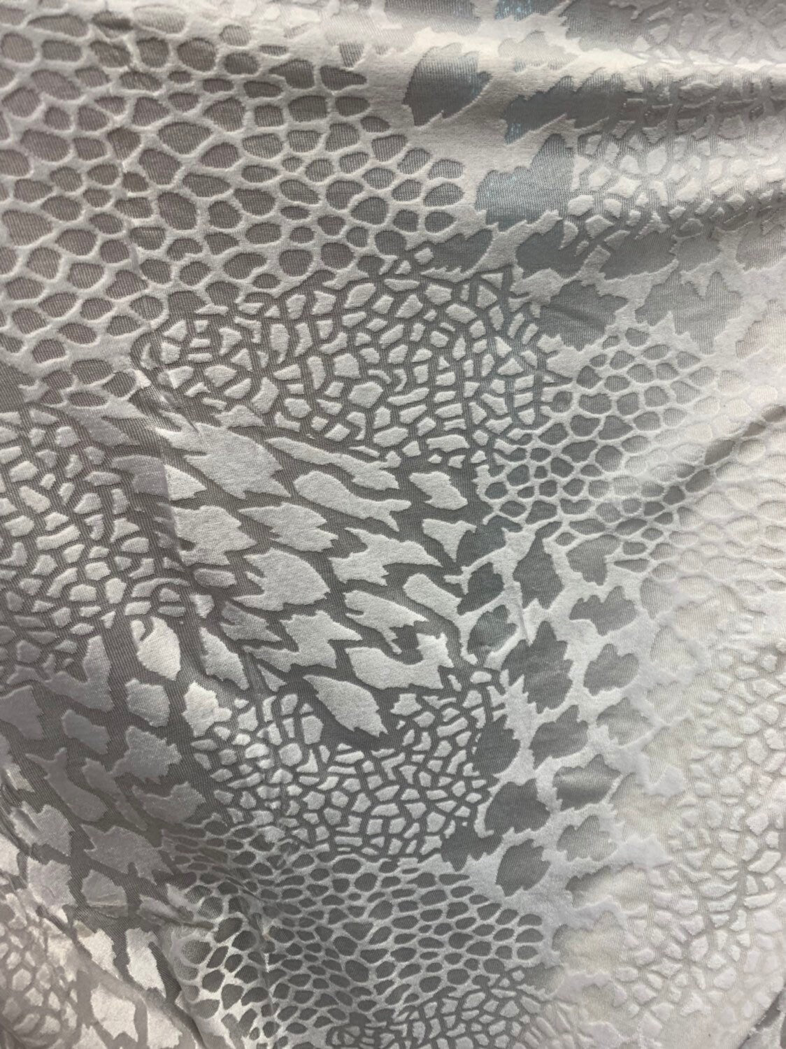 Burnout velvet animal print design white color 4way stretch 58/60" Sold by the Yd. Ships worldwide from Los Angeles California USA.