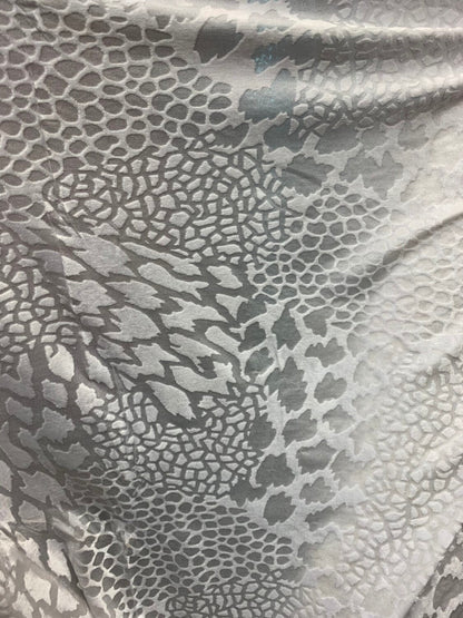 Burnout velvet animal print design white color 4way stretch 58/60" Sold by the Yd. Ships worldwide from Los Angeles California USA.