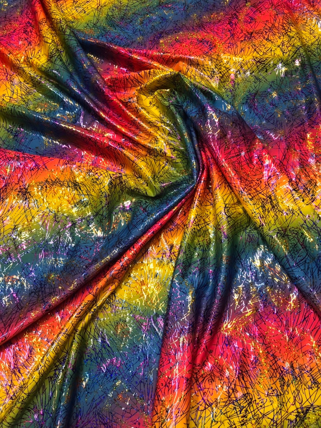 Bang bang design multicolor hologram foil print in nylon spandex 4way stretch 58/60" Sold by the YD. Ships worldwide from Los Angeles CA USA