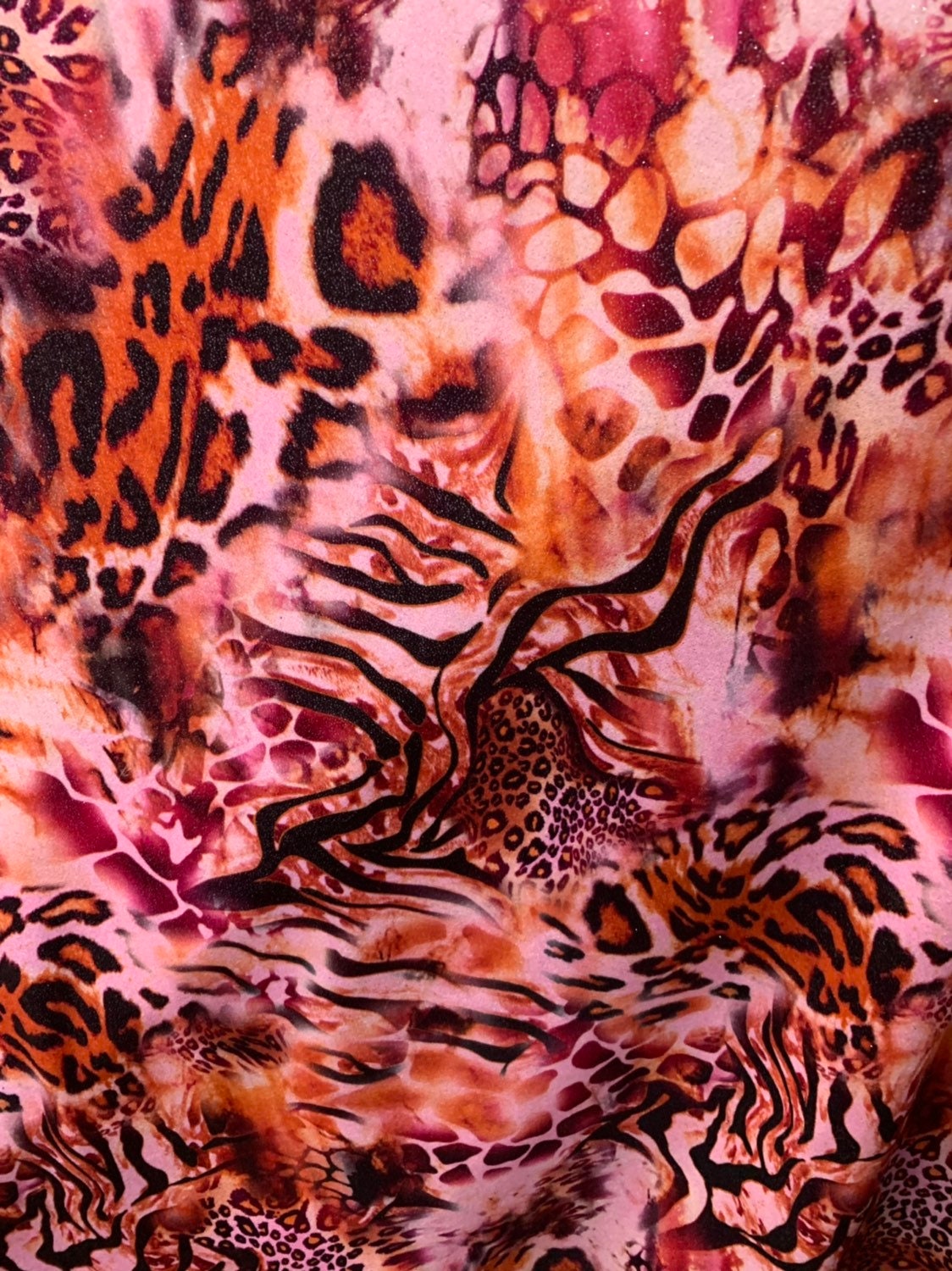 Multi animal print design on heavy stretch velvet 4way 58/60" Sold by the YD. Ships worldwide from Los Angeles California USA.