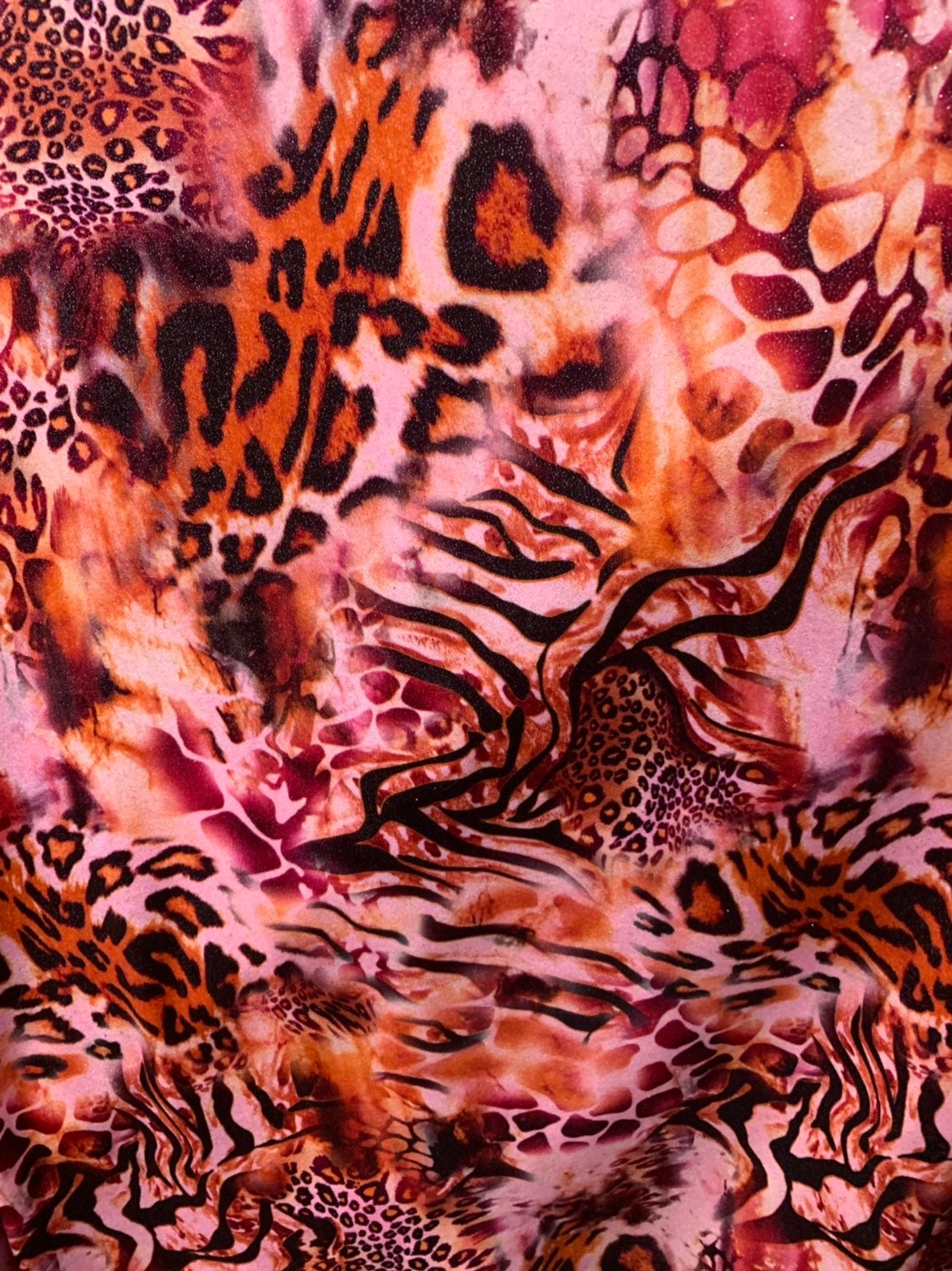 Multi animal print design on heavy stretch velvet 4way 58/60" Sold by the YD. Ships worldwide from Los Angeles California USA.