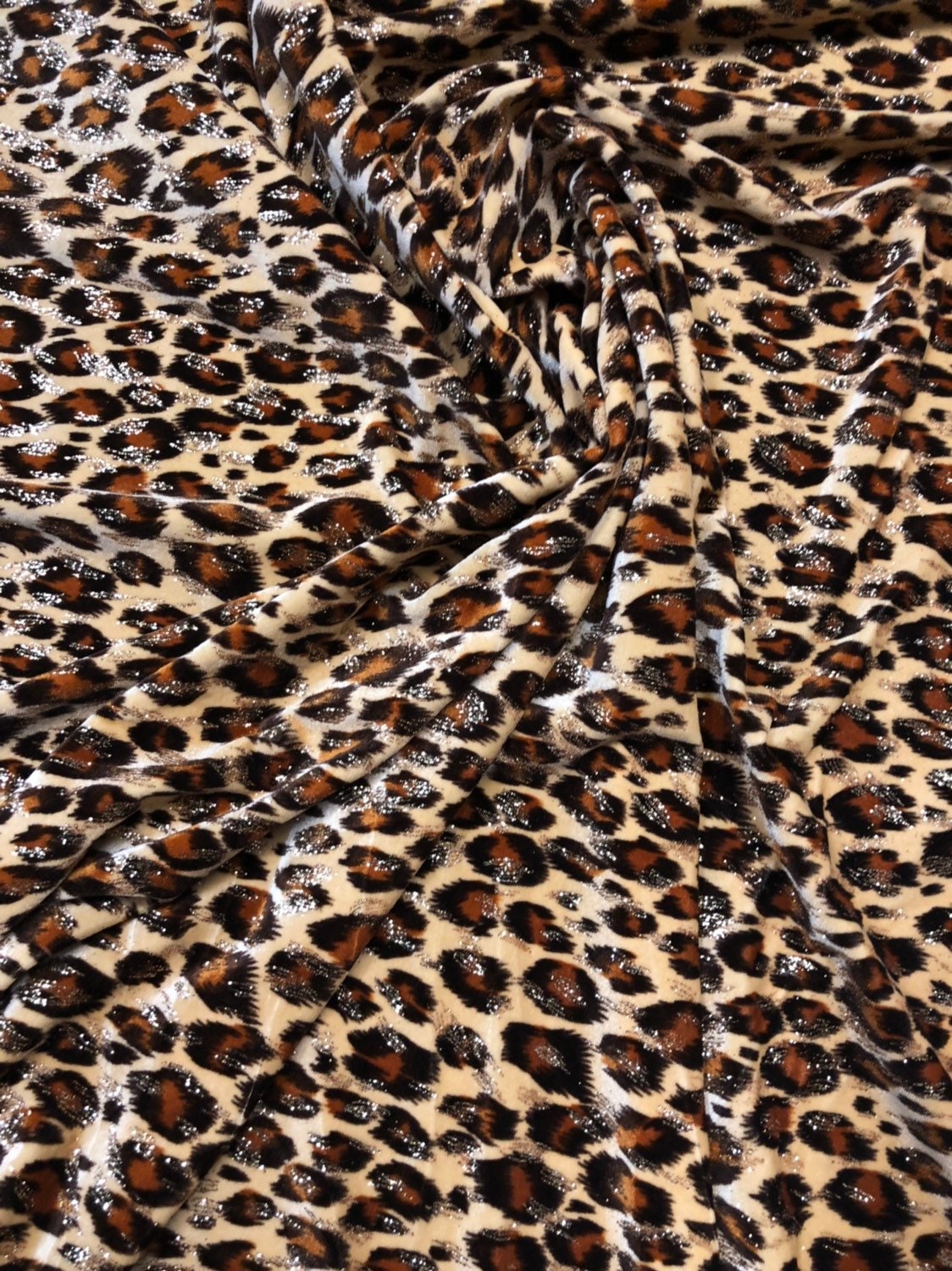 Leopard design with gold glitter print on velvet 420gsm 4way stretch 58/60" Sold by the YD. Ships worldwide from Los Angeles California USA.