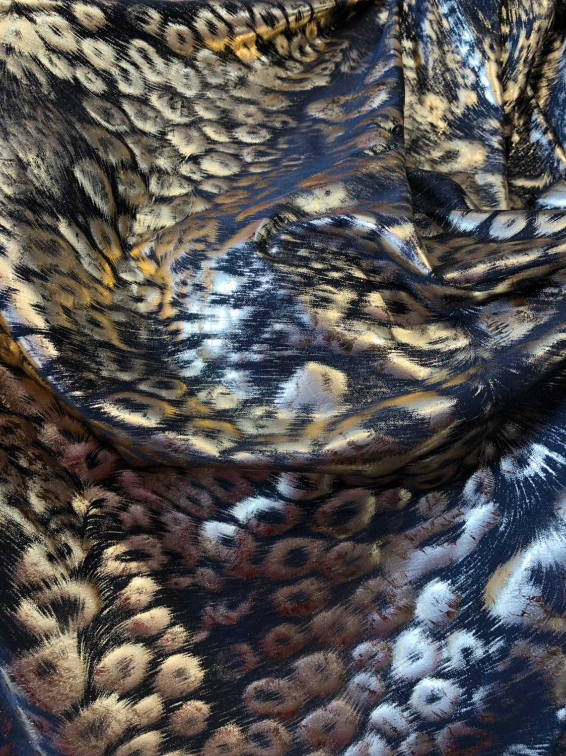 Animal print design black/gold metallic spandex 4way stretch 58/60" Sold by the YD. Ships worldwide from Los Angeles California USA.