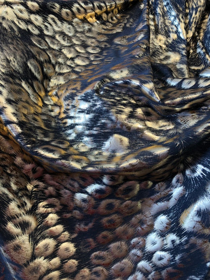 Animal print design black/gold metallic spandex 4way stretch 58/60" Sold by the YD. Ships worldwide from Los Angeles California USA.