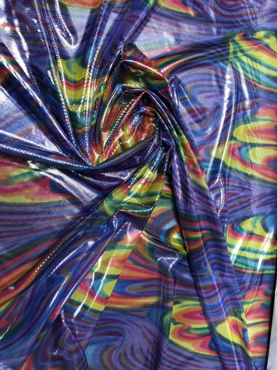 Paisley rainbow design metallic nylon spandex with foil dots 4way stretch 58/60" Sold by the YD. Ships worldwide from Los Angeles California