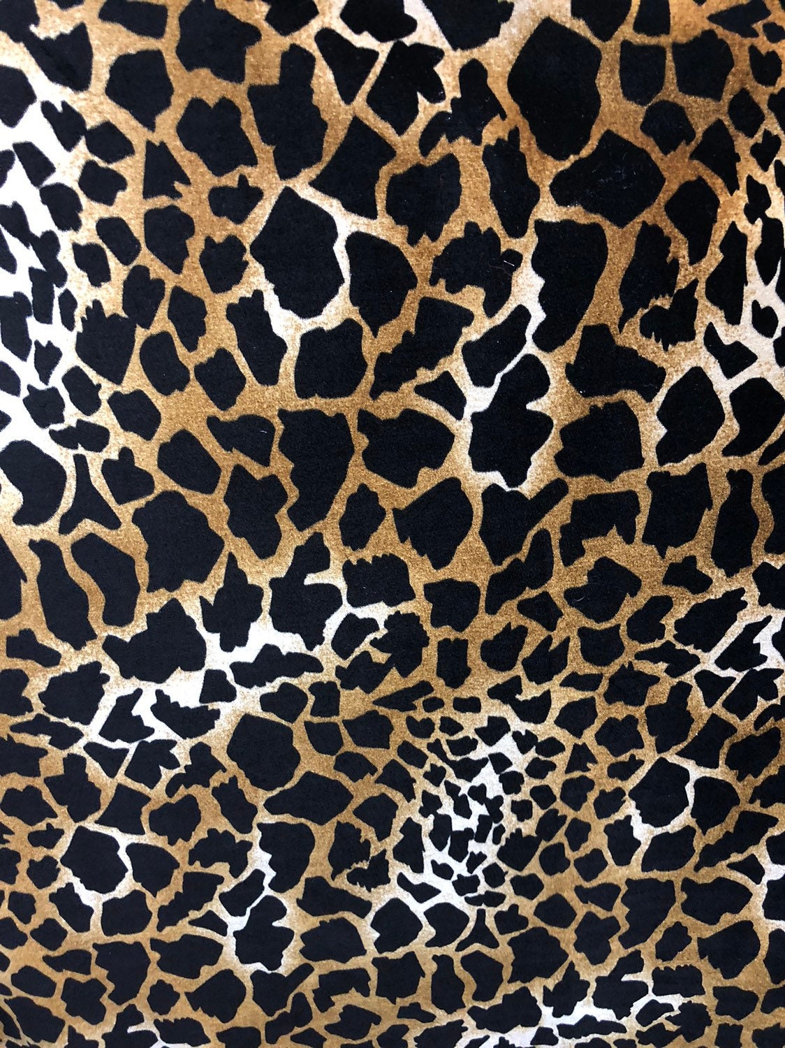 Giraffe design print on good quality stretch velvet 4way 58/60" Sold by the YD. Ships worldwide from Los Angeles California USA.