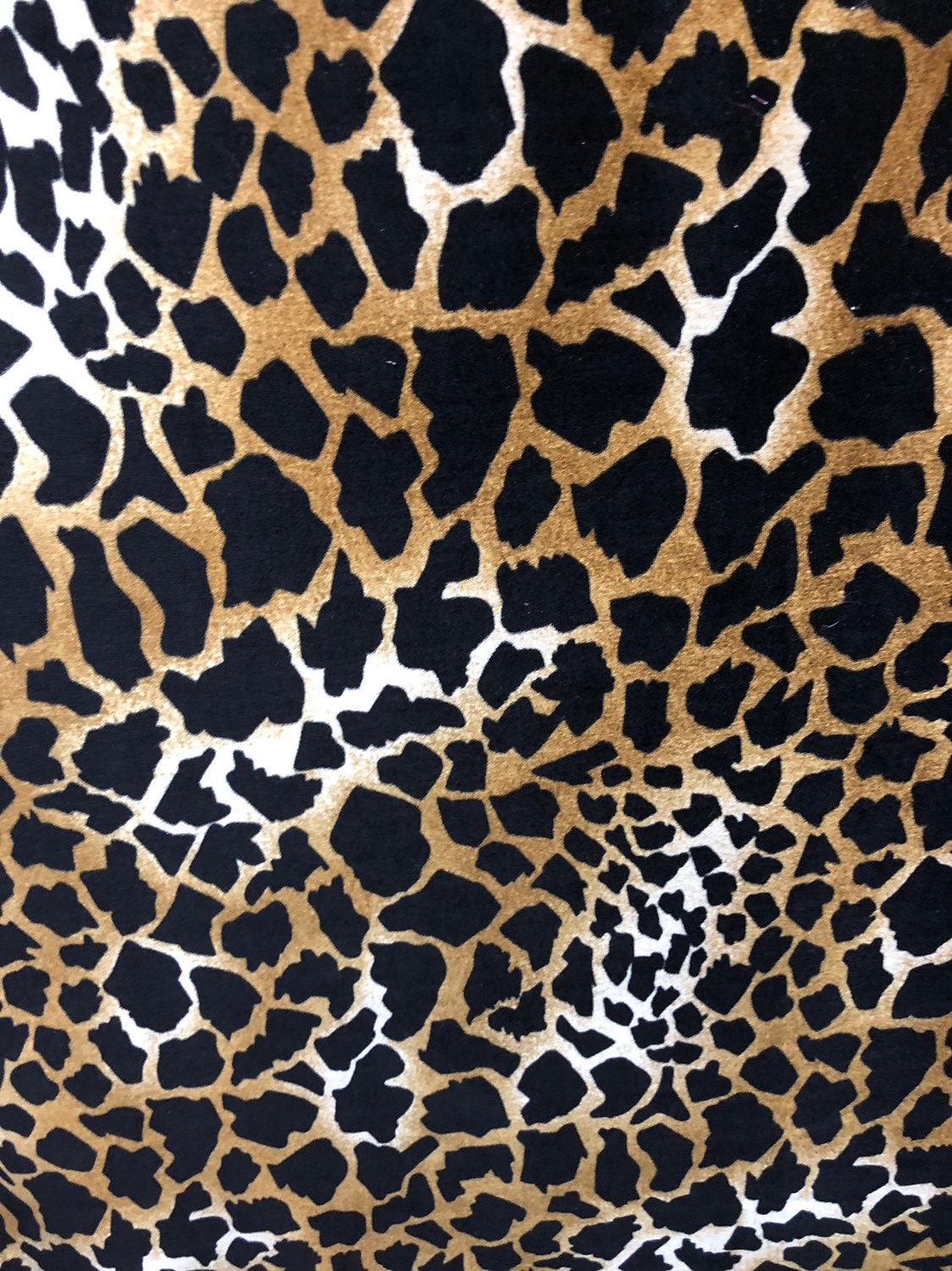 Giraffe design print on good quality stretch velvet 4way 58/60" Sold by the YD. Ships worldwide from Los Angeles California USA.