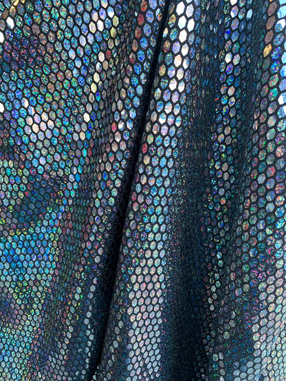 Metallic spandex with hexagon hologram sequins 2way stretch 58/60" Sold by the YD. Ships worldwide from Los Angeles California USA.