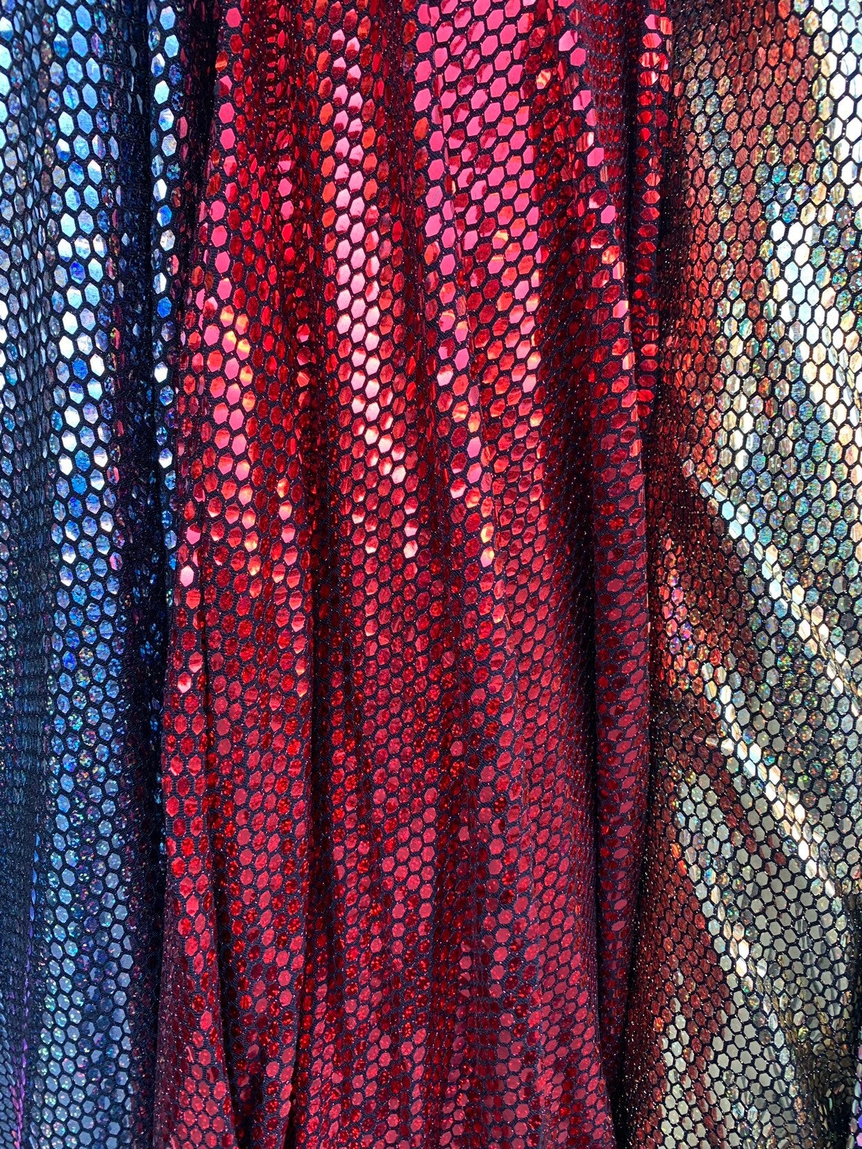 Metallic spandex with hexagon hologram sequins 2way stretch 58/60" Sold by the YD. Ships worldwide from Los Angeles California USA.