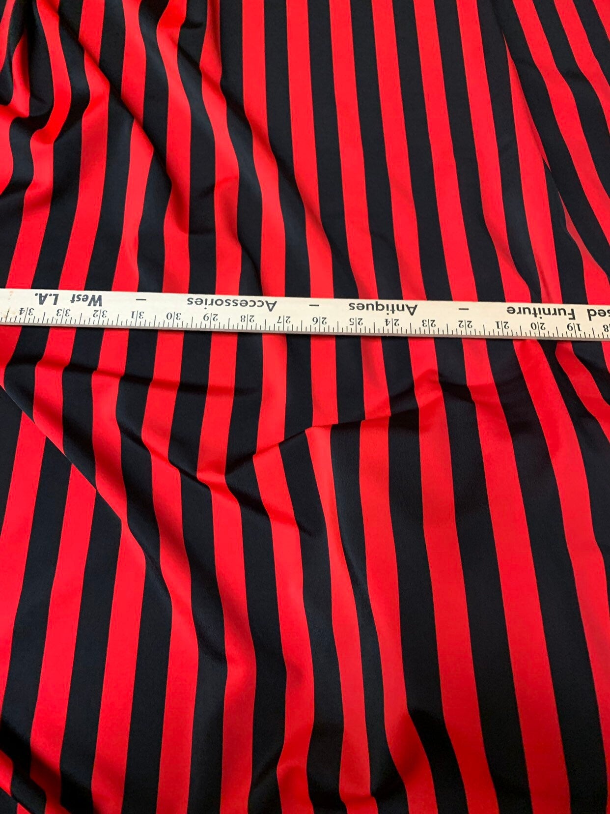 Stripe red/black nylon spandex 4way stretch 58/60" Sold by the YD. Ships worldwide from Los Angeles California USA.