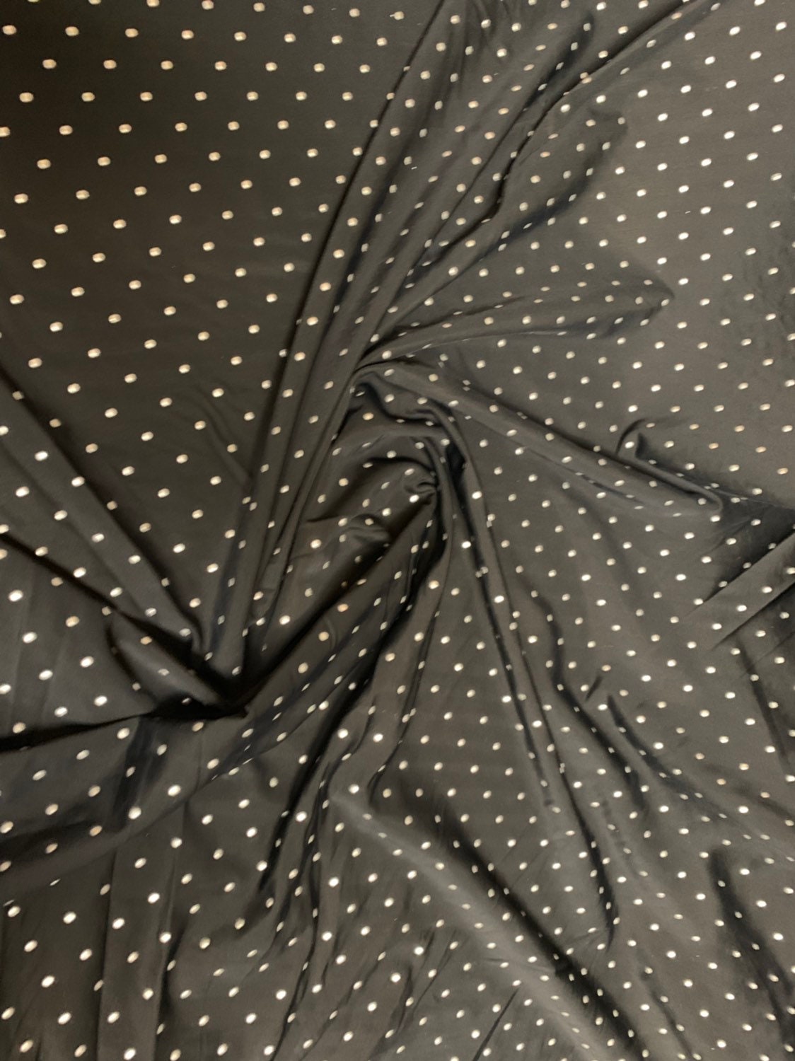 Metallic dots on heavy nylon spandex 4way stretch 58/60" Sold by the YD. Ships worldwide from Los Angeles California USA.