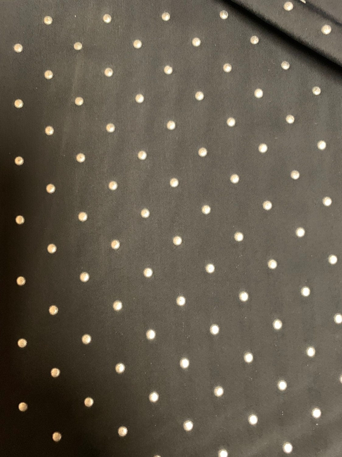 Metallic dots on heavy nylon spandex 4way stretch 58/60" Sold by the YD. Ships worldwide from Los Angeles California USA.