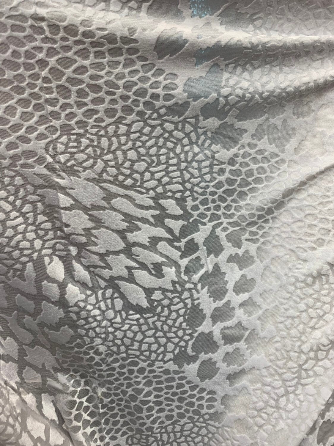 Burnout velvet animal print design white color 4way stretch 58/60" Sold by the Yd. Ships worldwide from Los Angeles California USA.