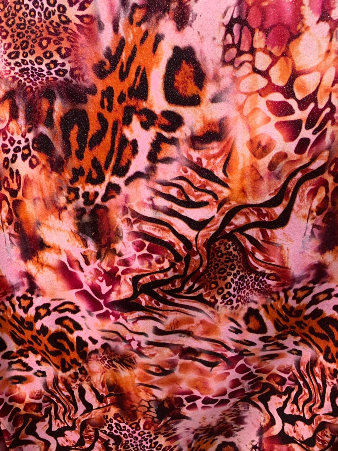 Multi animal print design on heavy stretch velvet 4way 58/60" Sold by the YD. Ships worldwide from Los Angeles California USA.