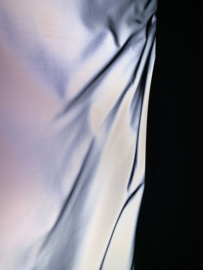 Reflective vinyl iridescent silver non stretch vinyl 58/60" Sold by the YD. Ships worldwide from Los Angeles California USA.