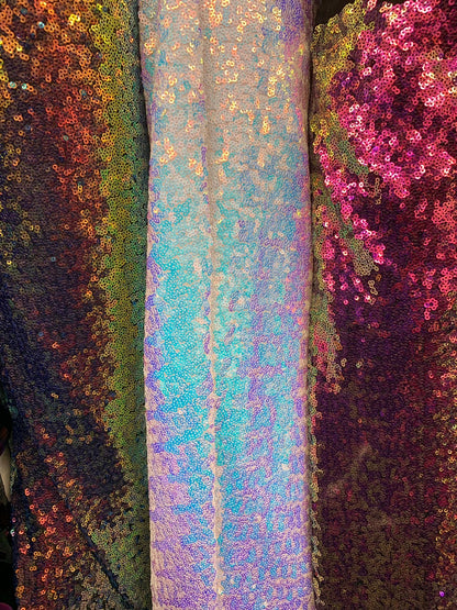 New iridescent sequins cosmic design 2tone glitz sequins on stretch power mesh 4way 58/60" Sold by the YD. Ships worldwide from Los Angeles