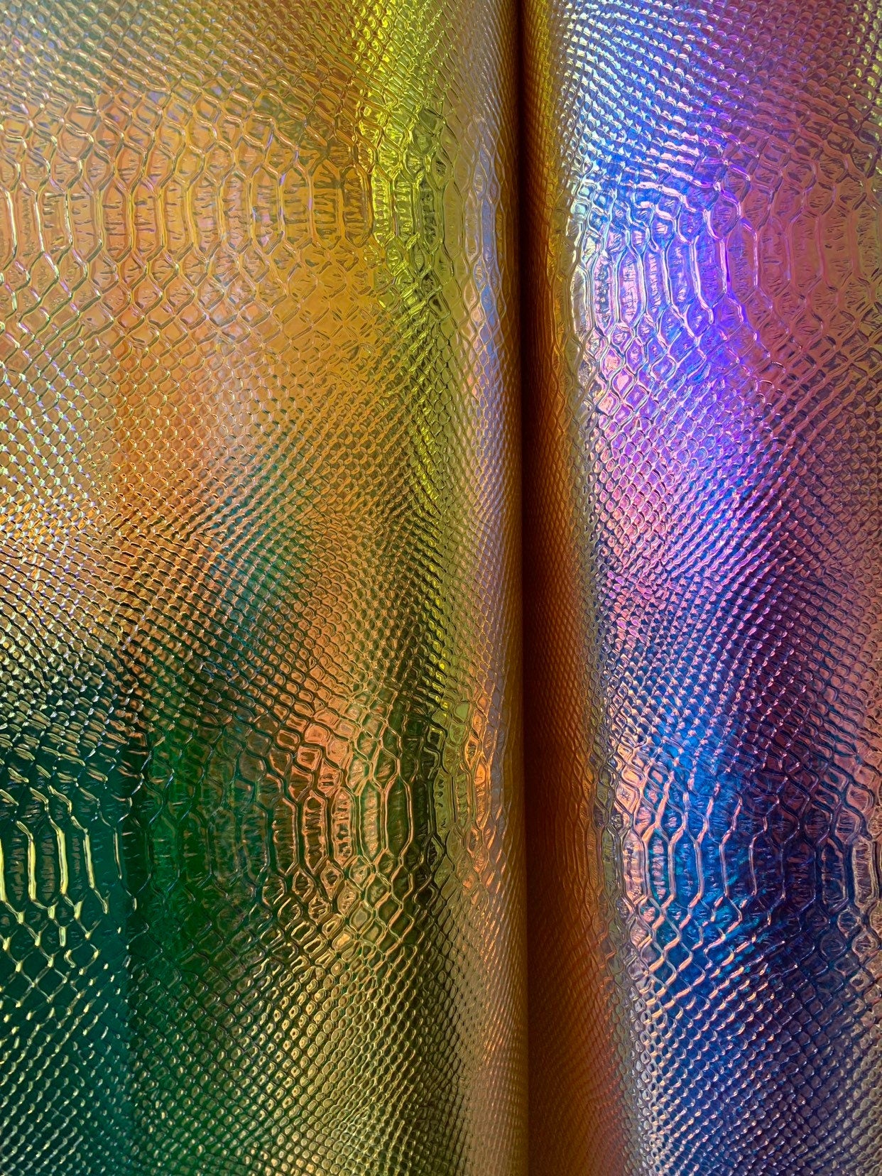 New iridescent white and yellow snake design clear vinyl non stretch 48/50" Sold by the YD. Ships worldwide from Los Angeles California USA