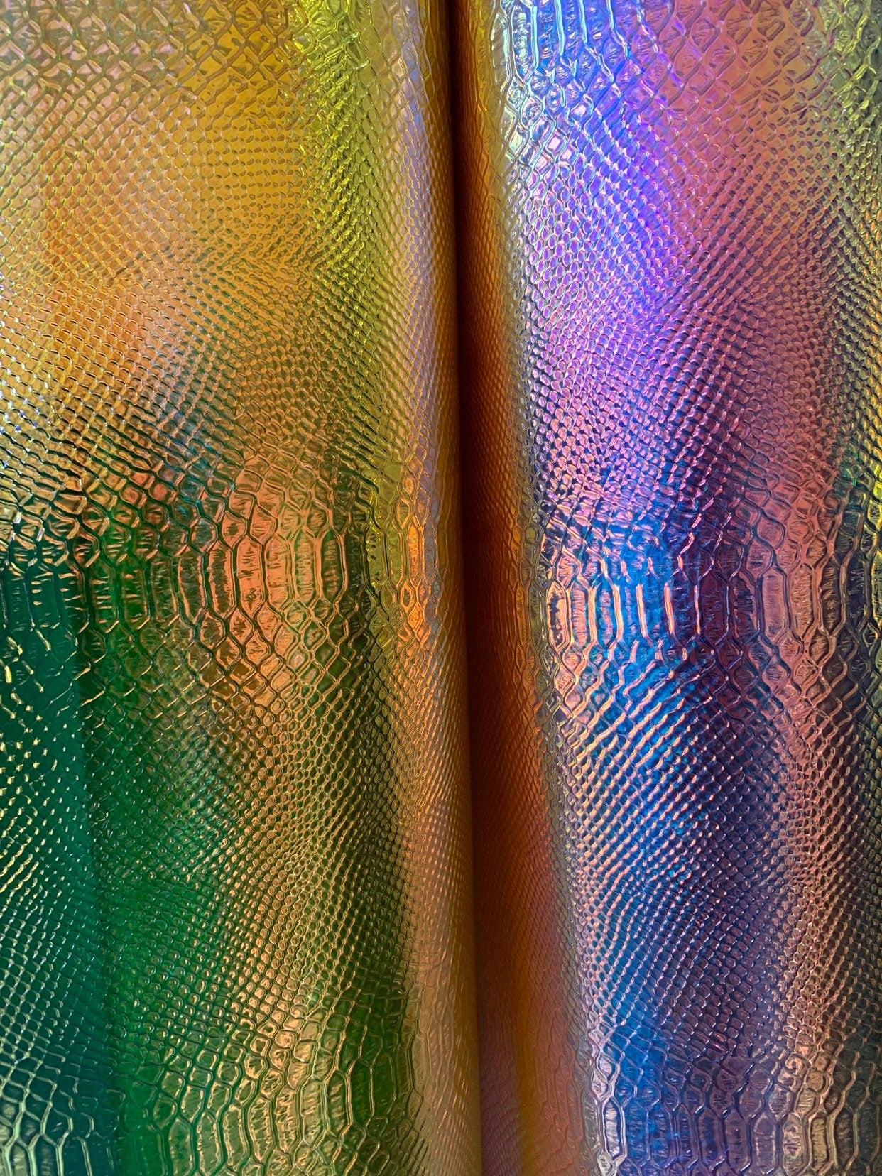 New iridescent white and yellow snake design clear vinyl non stretch 48/50" Sold by the YD. Ships worldwide from Los Angeles California USA