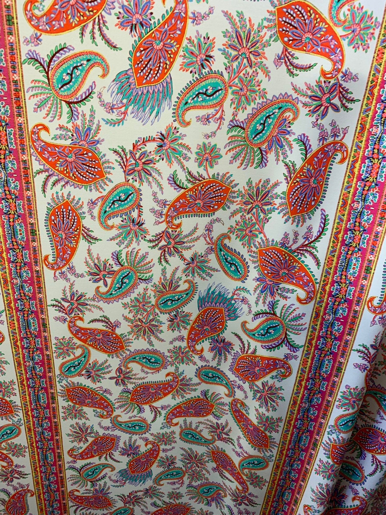 Paisley design multicolor print nylon spandex 4way stretch 58/60" Sold by the YD. Ships worldwide from Los Angeles California USA.