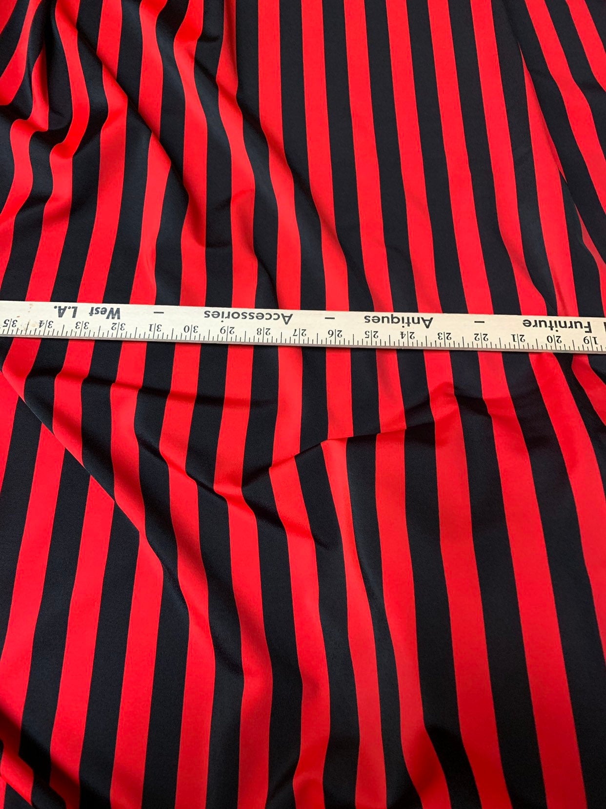 Stripe red/black nylon spandex 4way stretch 58/60" Sold by the YD. Ships worldwide from Los Angeles California USA.