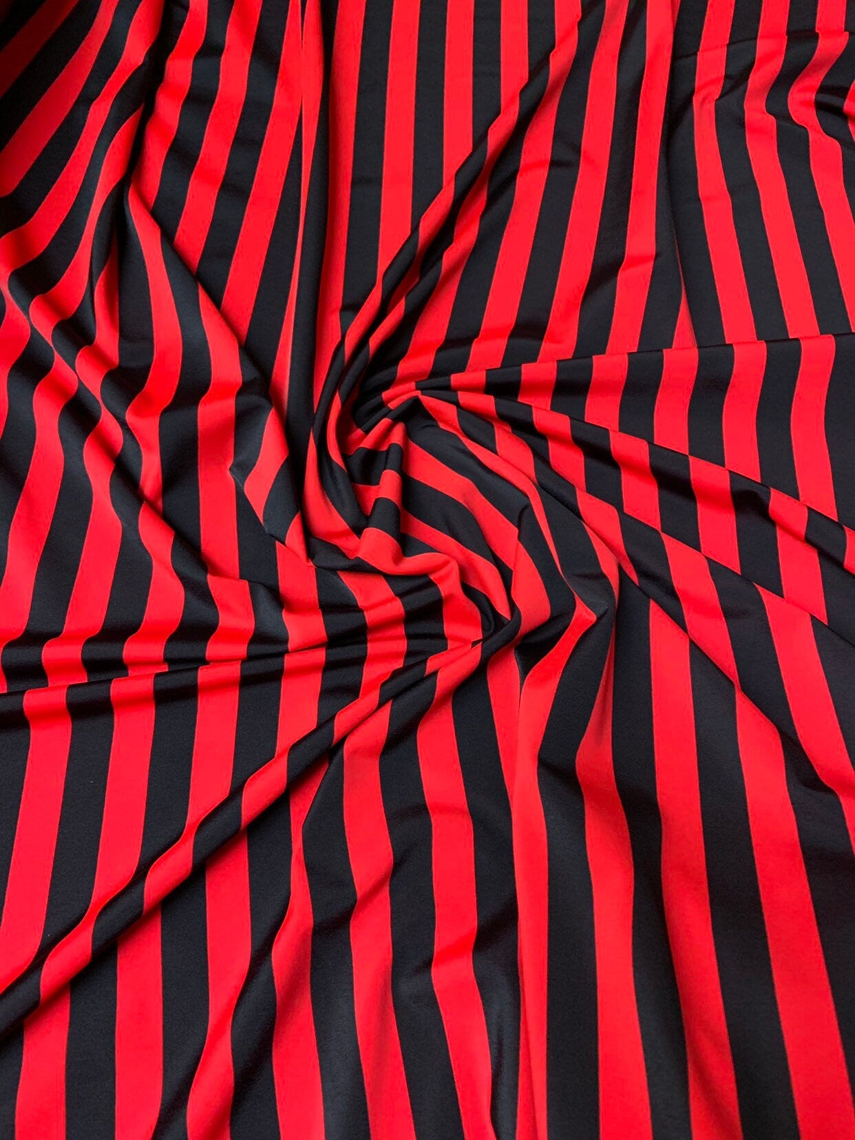 Stripe red/black nylon spandex 4way stretch 58/60" Sold by the YD. Ships worldwide from Los Angeles California USA.