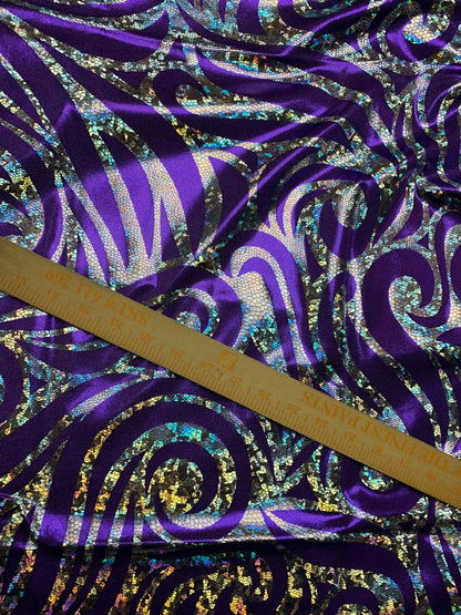 Metallic spandex with swirl hologram foil design 58/60" sold by the yd. Ships worldwide from Los Angeles CA United States.
