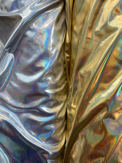 Iridescent silver all over foil metallic nylon Spandex 4way stretch 58/60" Sold by the YD. Ships worldwide from Los Angeles California USA